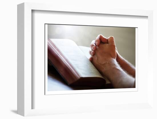 Hands Praying on a Holy Bible-null-Framed Premium Giclee Print