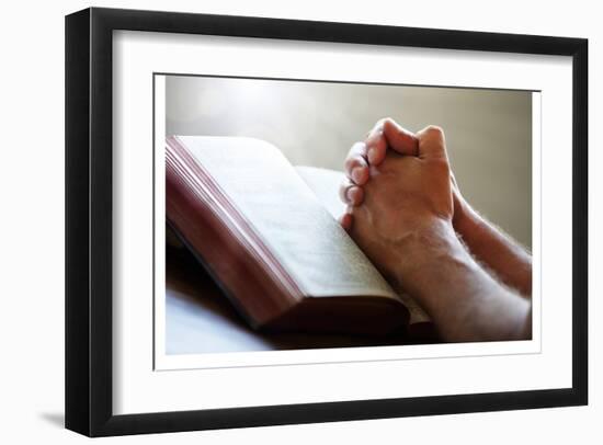 Hands Praying on a Holy Bible-null-Framed Art Print