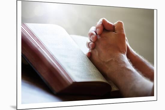 Hands Praying on a Holy Bible-null-Mounted Art Print