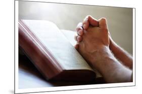 Hands Praying on a Holy Bible-null-Mounted Art Print