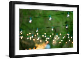 Hanging Decorative Christmas Lights For A Back Yard Party-imging-Framed Photographic Print