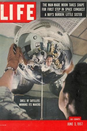 Naval Research Lab Worker Examining Shell of a Satellite, June 3, 1957