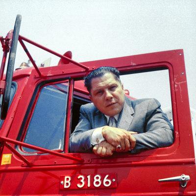 Portrait of Teamsters Union Pres. Jimmy Hoffa Leaning Out Window of Red Truck
