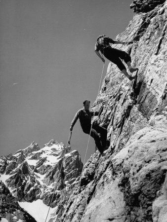 People Climbing the Teton Mountains