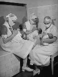 Special Nursery Nurses Wearing Masks as They Bottle-Feed Fully Developed Premature Babies-Hansel Mieth-Photographic Print