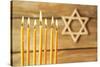 Hanukkah Candle on Wooden Background-Yastremska-Stretched Canvas