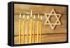 Hanukkah Candle on Wooden Background-Yastremska-Framed Stretched Canvas