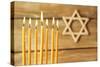 Hanukkah Candle on Wooden Background-Yastremska-Stretched Canvas