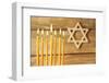 Hanukkah Candle on Wooden Background-Yastremska-Framed Photographic Print