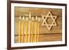 Hanukkah Candle on Wooden Background-Yastremska-Framed Photographic Print