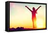 Happy Celebrating Winning Success Woman at Sunset or Sunrise Standing Elated with Arms Raised up Ab-Maridav-Framed Stretched Canvas