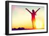 Happy Celebrating Winning Success Woman at Sunset or Sunrise Standing Elated with Arms Raised up Ab-Maridav-Framed Photographic Print