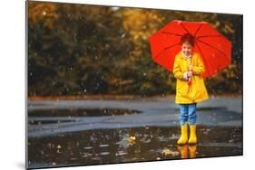 Happy Child Girl with an Umbrella and Rubber Boots in Puddle on an Autumn Walk-null-Mounted Photographic Print