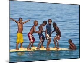 Happy Children Playing on the Beach of Savo Island, Solomon Islands, Pacific-Michael Runkel-Mounted Photographic Print