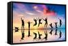 Happy Group Of Friends, Family With Dog And Cat Jumping Together At Sunset, Water Reflection-Michal Bednarek-Framed Stretched Canvas