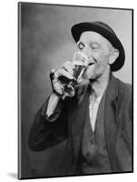 Happy Old Man Drinking Glass of Beer, with His Daintier Finger Extended. 1937-null-Mounted Art Print