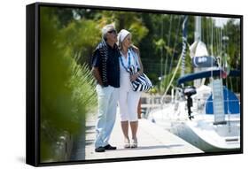 Happy Senior Couple Walking on a Dock in Summer-stefanolunardi-Framed Stretched Canvas