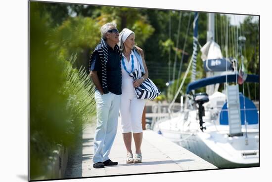 Happy Senior Couple Walking on a Dock in Summer-stefanolunardi-Mounted Photographic Print