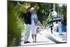 Happy Senior Couple Walking on a Dock in Summer-stefanolunardi-Mounted Photographic Print