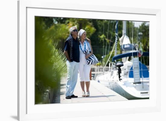 Happy Senior Couple Walking on a Dock in Summer-stefanolunardi-Framed Photographic Print