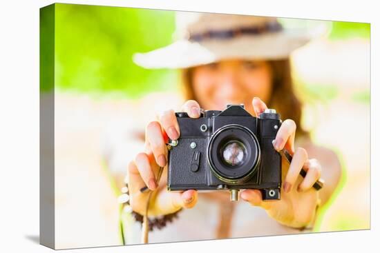 Happy Young Girl With Camera Outdoors-chesterf-Stretched Canvas