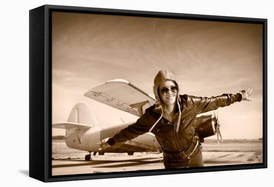 Happy Young Woman with Raised Hands  Flying on Airporte, Sepia Photo.-Aleksandar Todorovic-Framed Stretched Canvas