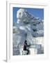 Harbin City, A Tourist Is Playing a Sculpted Ice Piano, Snow and Ice Festival, China-Christian Kober-Framed Photographic Print