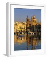 Harbour with Luzzu Fishing Boats and Marsaxlokk Parish Church at Sunrise, Marsaxlokk, Malta, Medite-Stuart Black-Framed Photographic Print