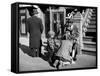 Harlem Street Scene Showing a Man Getting a Shoeshine as a Young Child Watches Intently-null-Framed Stretched Canvas