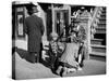 Harlem Street Scene Showing a Man Getting a Shoeshine as a Young Child Watches Intently-null-Stretched Canvas