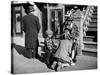 Harlem Street Scene Showing a Man Getting a Shoeshine as a Young Child Watches Intently-null-Stretched Canvas