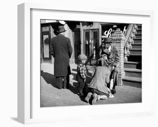 Harlem Street Scene Showing a Man Getting a Shoeshine as a Young Child Watches Intently-null-Framed Photographic Print