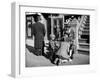 Harlem Street Scene Showing a Man Getting a Shoeshine as a Young Child Watches Intently-null-Framed Photographic Print