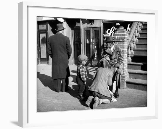 Harlem Street Scene Showing a Man Getting a Shoeshine as a Young Child Watches Intently-null-Framed Photographic Print