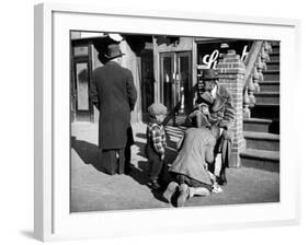 Harlem Street Scene Showing a Man Getting a Shoeshine as a Young Child Watches Intently-null-Framed Photographic Print