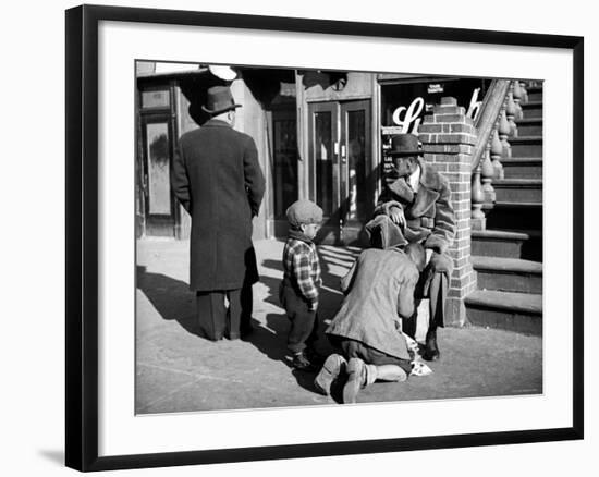 Harlem Street Scene Showing a Man Getting a Shoeshine as a Young Child Watches Intently-null-Framed Photographic Print