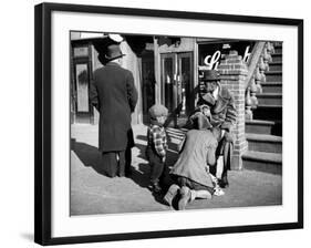 Harlem Street Scene Showing a Man Getting a Shoeshine as a Young Child Watches Intently-null-Framed Photographic Print