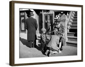 Harlem Street Scene Showing a Man Getting a Shoeshine as a Young Child Watches Intently-null-Framed Photographic Print