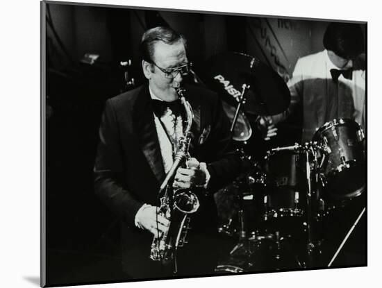 Harry Bence Playing the Saxophone at the Forum Theatre, Hatfield, Hertfordshire, 1984-Denis Williams-Mounted Photographic Print