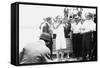 Harry Houdini being handcuffed before being nailed into a crate and lowered into New York Bay, 1912-George Grantham Bain-Framed Stretched Canvas