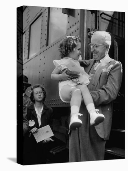 Harry Truman Holding up 3 Yr Old Suzanne Bump after the Town's Postmaster Pressed Her into Service-Hank Walker-Stretched Canvas