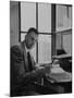 Harvard University Professor John Kenneth Galbraith Sitting in a Harvard Library-Dmitri Kessel-Mounted Premium Photographic Print