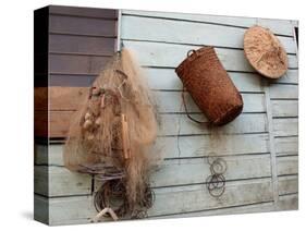 Hat, Basket, and Fishing Net Hanging Outside Iban Longhouse, Sarawak, Borneo, Malaysia-Jay Sturdevant-Stretched Canvas