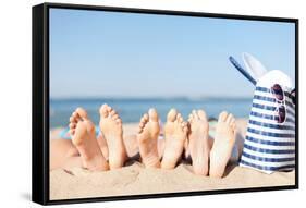 Hats and Summer Concept - Three Women Lying on the Beach with Straw Hat, Sunglasses and Bag-dolgachov-Framed Stretched Canvas