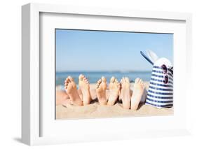 Hats and Summer Concept - Three Women Lying on the Beach with Straw Hat, Sunglasses and Bag-dolgachov-Framed Photographic Print