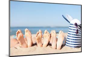 Hats and Summer Concept - Three Women Lying on the Beach with Straw Hat, Sunglasses and Bag-dolgachov-Mounted Photographic Print