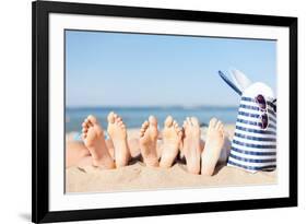 Hats and Summer Concept - Three Women Lying on the Beach with Straw Hat, Sunglasses and Bag-dolgachov-Framed Photographic Print