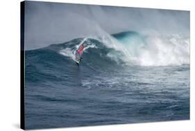 Hawaii, Maui. Lone Figure Windsurfing Monster Waves at Pe'Ahi Jaws, North Shore Maui-Janis Miglavs-Stretched Canvas