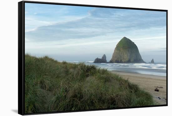 Hay Stack Rock on the sandy beach at Cannon Beach, Oregon-Greg Probst-Framed Stretched Canvas