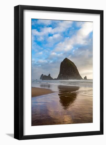 Haystack Rock reflected on the shoreline at Cannon Beach on the Pacific Northwest coast, Oregon, Un-Martin Child-Framed Photographic Print